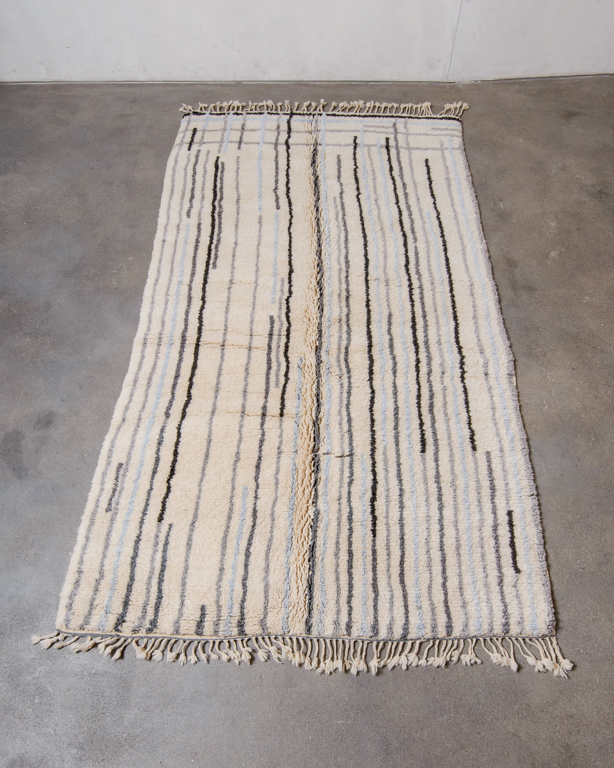 Berberlin Finest Beniourain Rug laid flat on concrete floor.